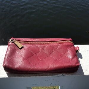 Longchamp Monogrammed Leather Top Zip Clutch in Mulberry Wine
